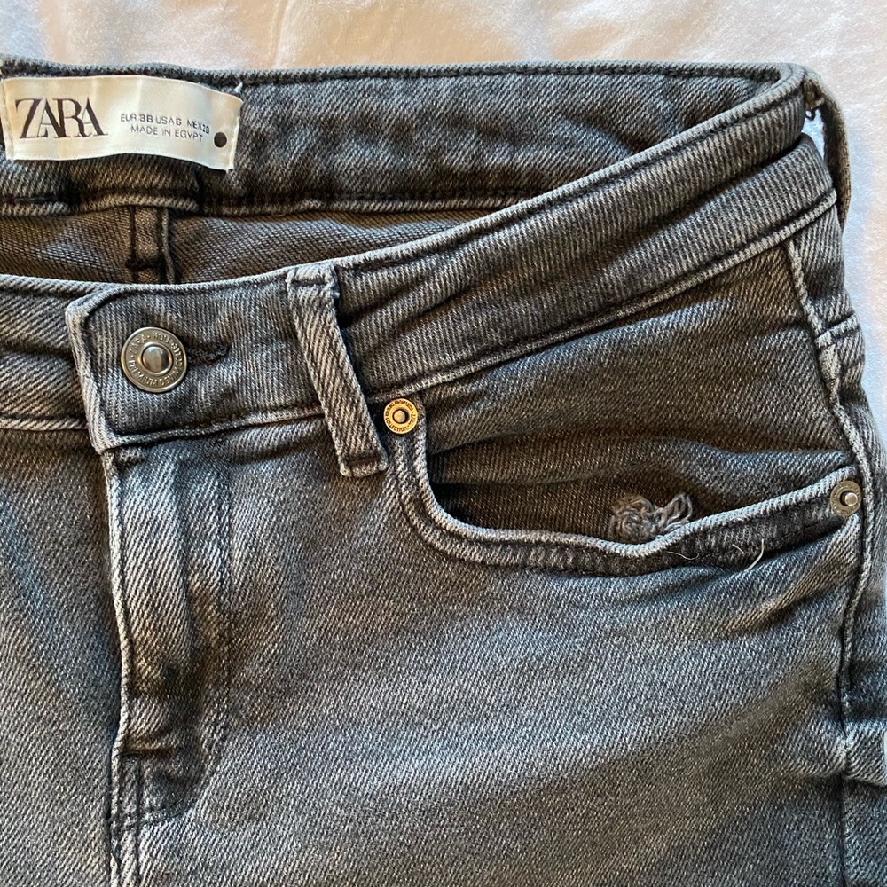 Zara’s black washed mid-rise jeans